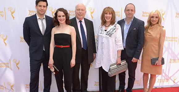 Downton Abbey Cast members and producers Julian Fellowes and Gareth Naeme mug for cameras before their webast.