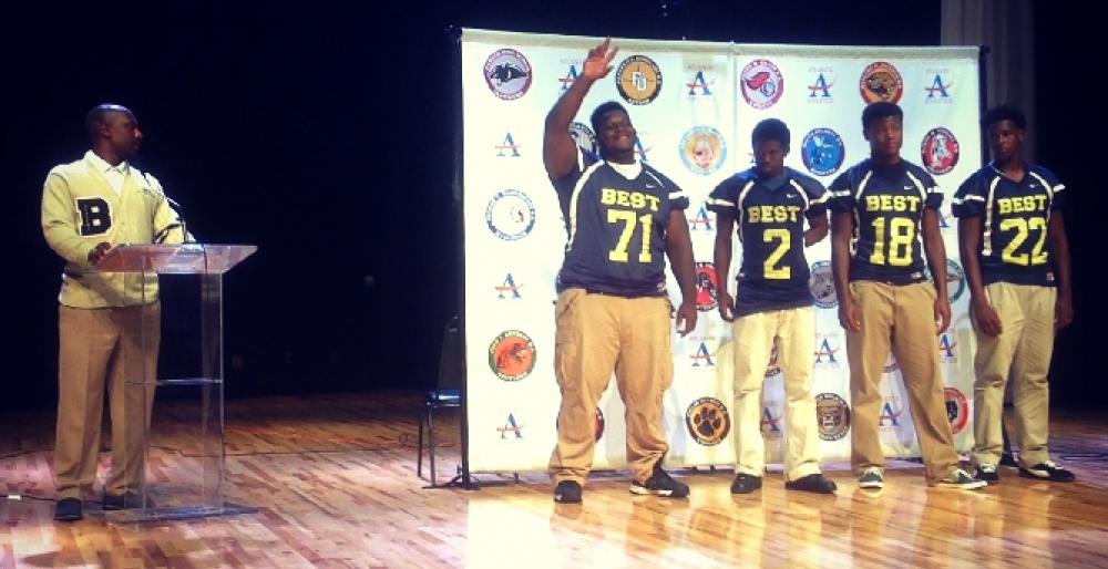 Head Coach Joshua Moore introduces senior defensive tackle/offensive guard Tyler Gibson at APS Media Day.