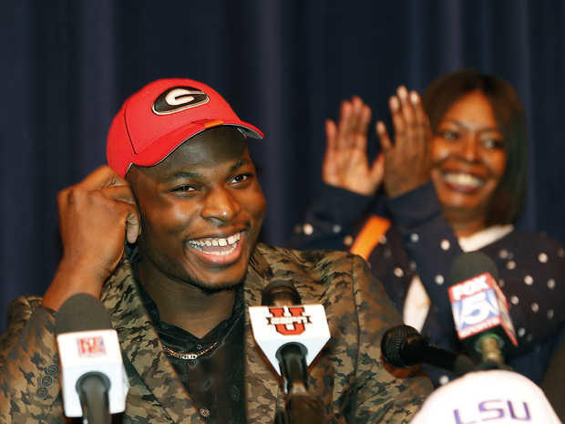 Former Norcross DE Lorenzo Carter announces his decision to sign with UGA on National Signing Day '14 Former Norcross DE Lorenzo Carter announces his decision to sign with UGA on National Signing Day '14