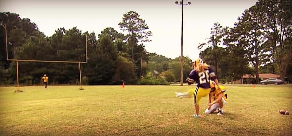 Taylor Tidaback attempts a field goal during football practice.