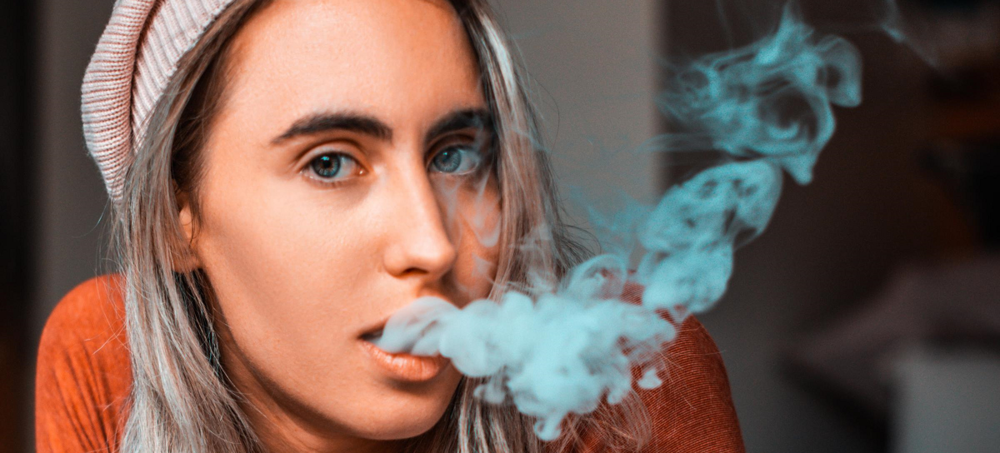 A teenaged girl vapes 