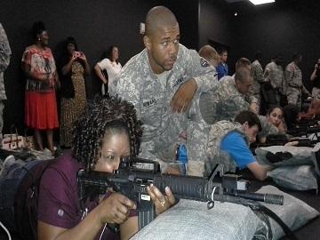 Rolinda Cary shoots a training rifle. Credit: Emily Jones