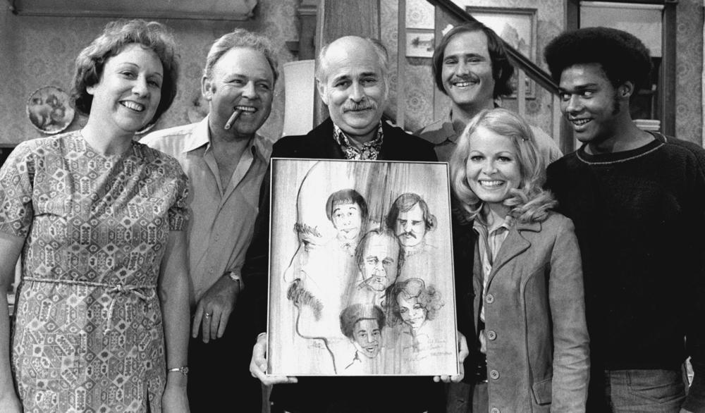 Norman Lear (center) created, developed and produced the hit show <em>All in the Family</em>, which ran from 1971 to 1979. The politically charged sitcom starred Jean Stapleton, Carroll O'Connor, Rob Reiner, Sally Struthers and Mike Evans.