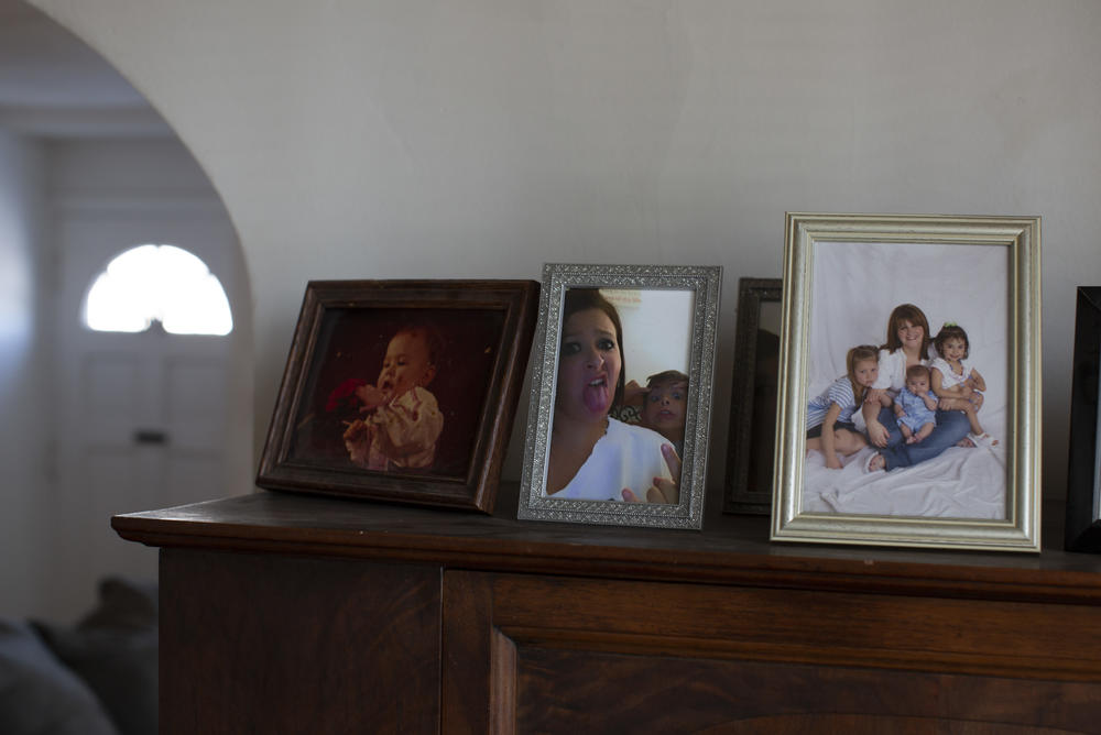 Kristen Trogler keeps family photos, including one of her as a baby and then as a mother with her three children.