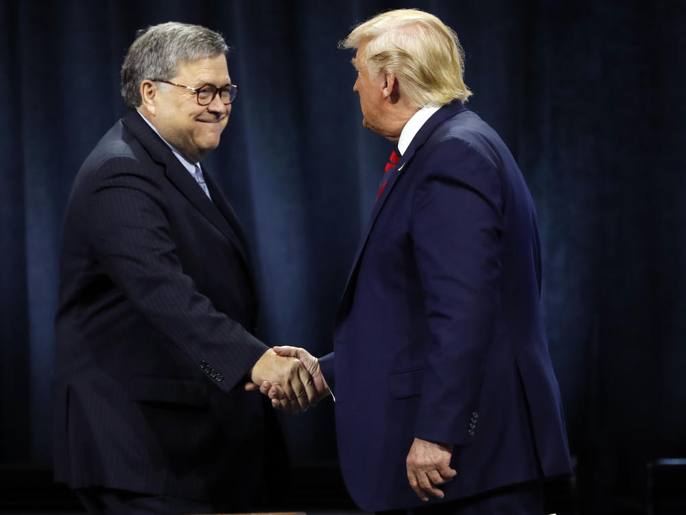 President Trump greets Barr before signing an executive order creating a commission to study law enforcement and justice in October 2019.