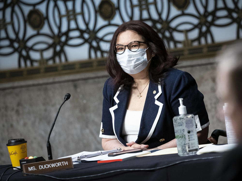 Senator Tammy Duckworth, a Democrat from Illinois, wears a protective mask during a Senate Armed Services Committee hearing in May.
