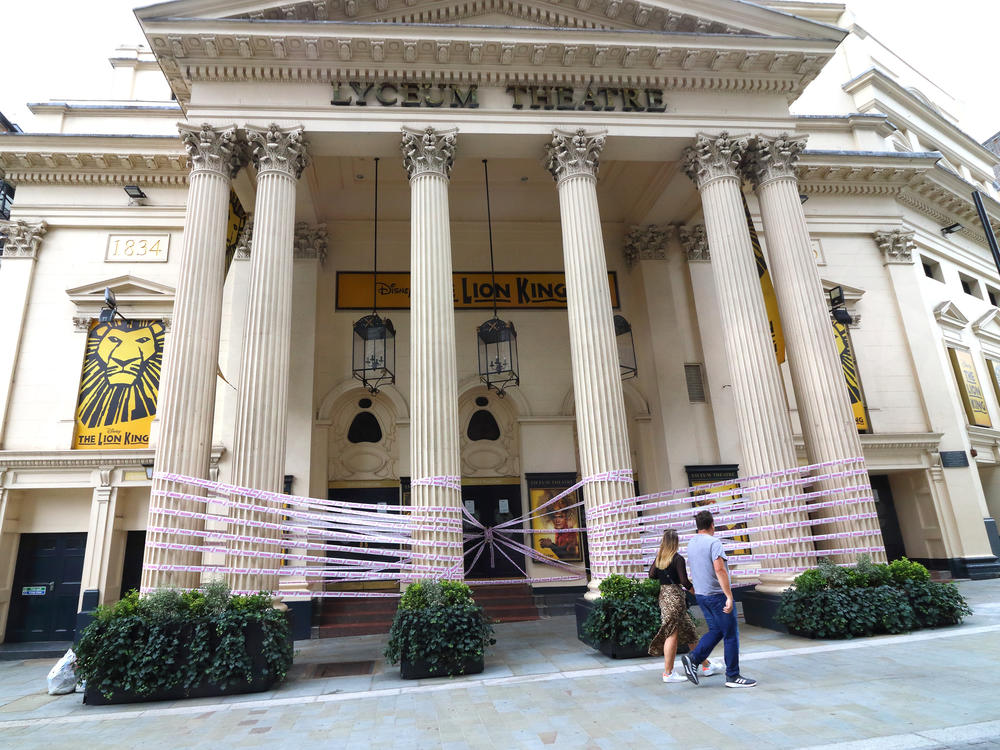 London's Lyceum Theatre is wrapped in pink tape bearing the words 