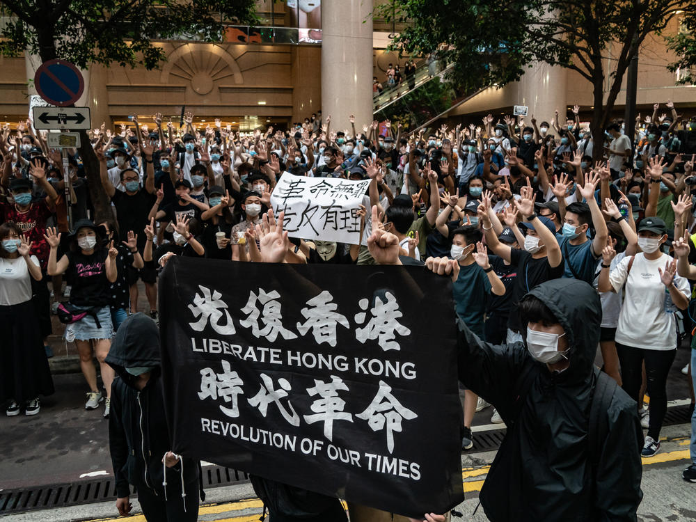 Demonstrators take part in a protest against China's new national security law in Hong Kong on July 1, the day Hong Kong was marking the 23rd anniversary of its handover from Britain to China.