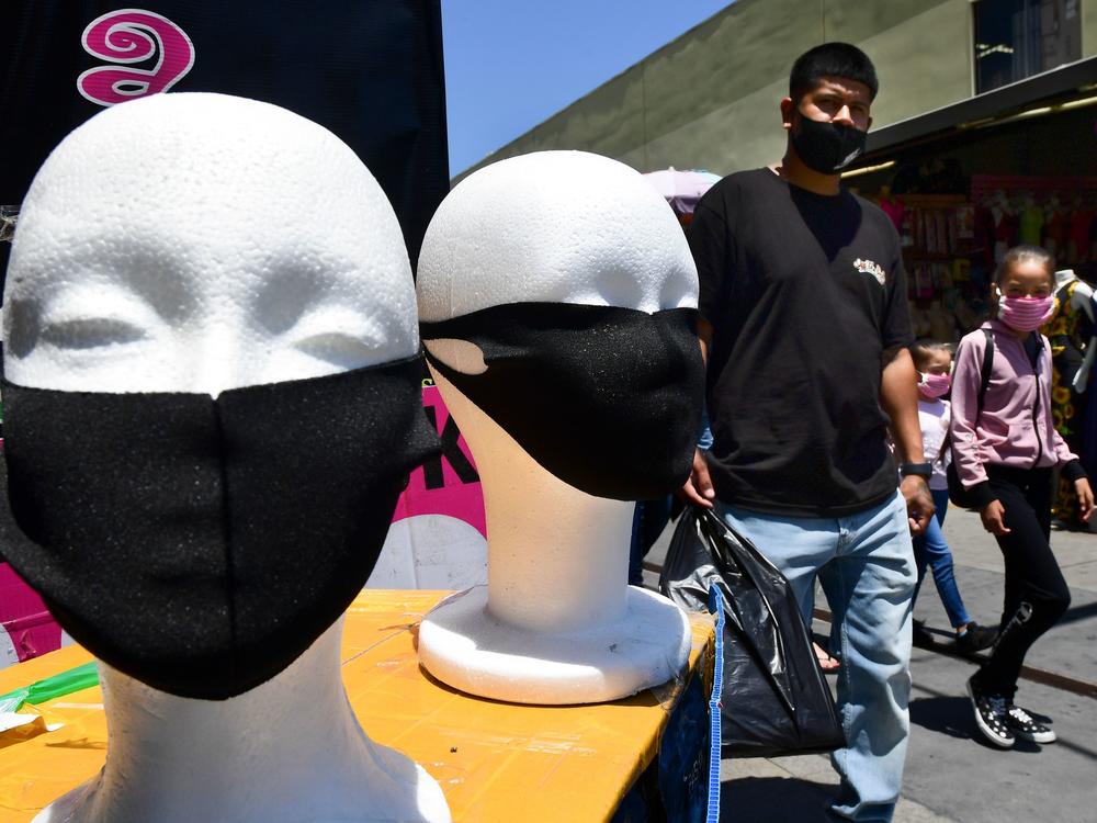 Face coverings are seen on display in Los Angeles on July 2. California Gov. Gavin Newsom threatened this week to withhold up to $2.5 billion in aid to local police departments that refuse to enforce mask rules and other pandemic-related mandates.