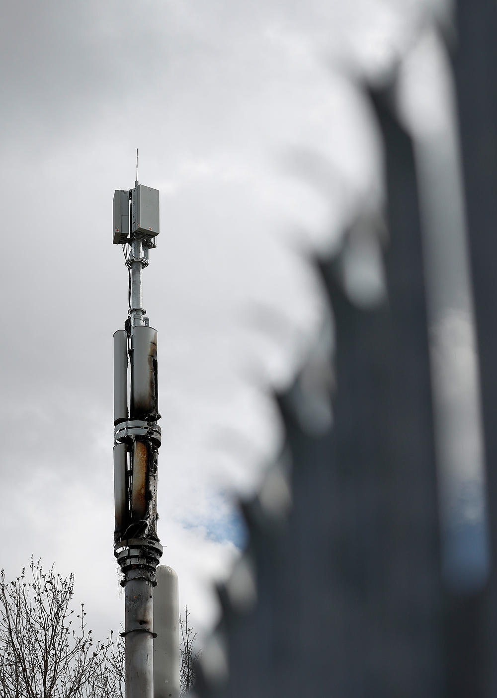 A fire-damaged telecom tower stands in Birmingham, England, in April. Authorities have cited conspiracy theories about 5G and the coronavirus as a possible motivation for a rash of such fires in the U.K.