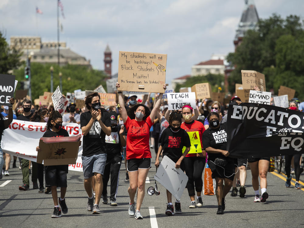 Black Students Matter demonstrators march en route to a rally at the Department of Education in Washington, D.C., on June 19.