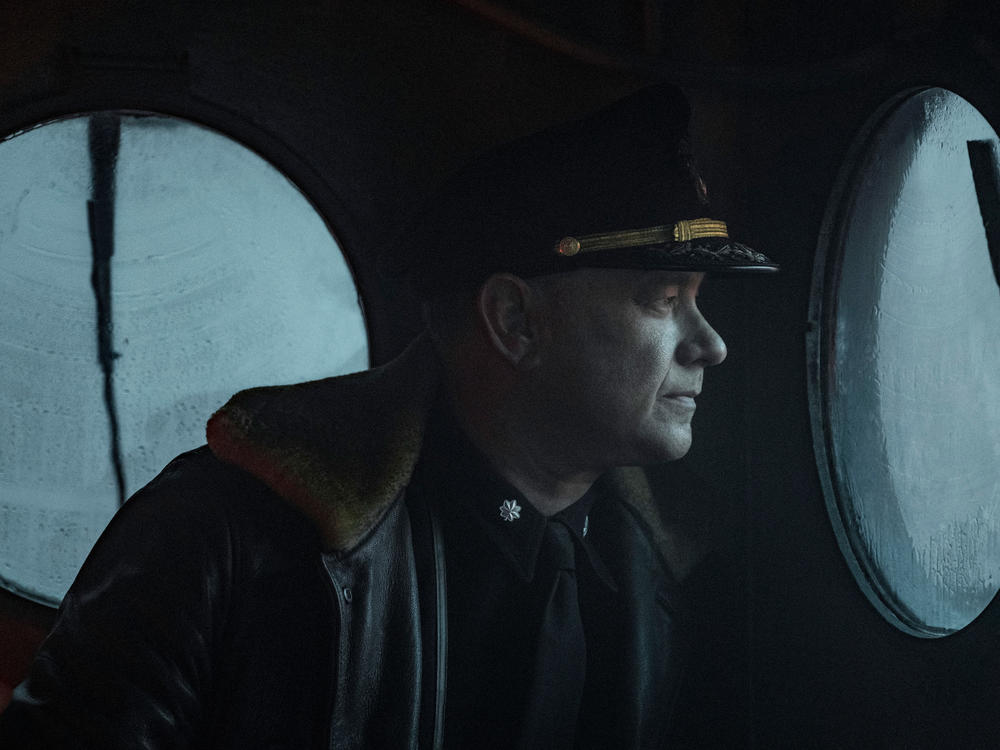 Captain Krause (Tom Hanks) looks astern in <em>Greyhound</em>.