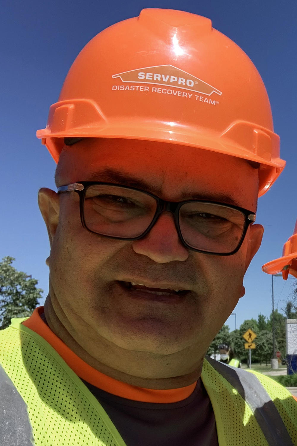 Recovery worker Armando Negron stands outside a hospital in Michigan. Negron tested positive for the coronavirus while in Michigan and headed home to Florida, where he landed in the hospital for six days.