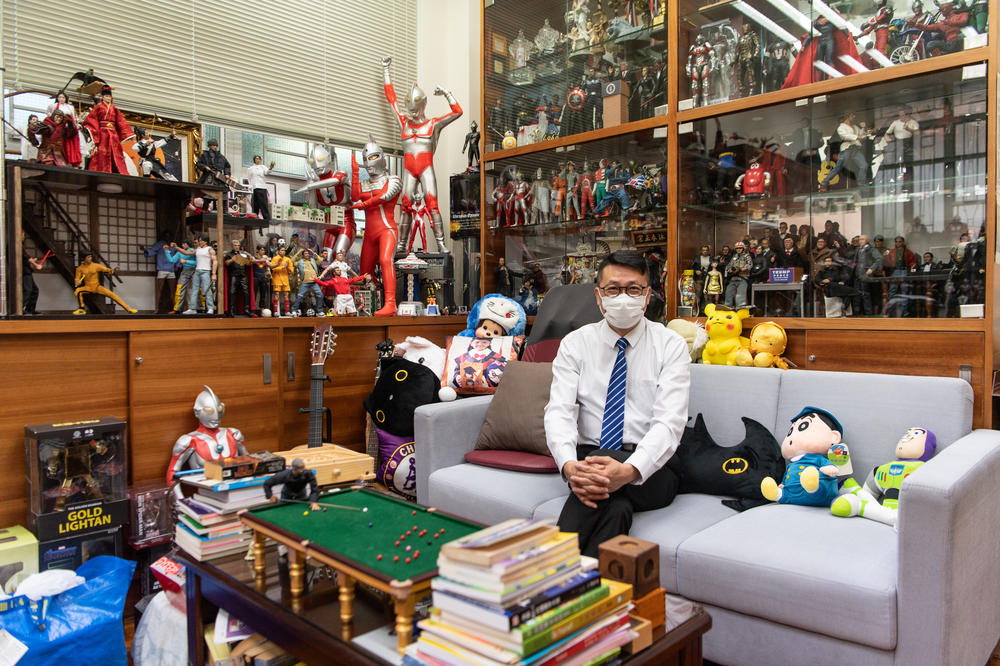 Lobo Ho, principal of Maryknoll Fathers' Secondary School, fills his office with toys and figurines so a visit to the principal won't be a negative experience.