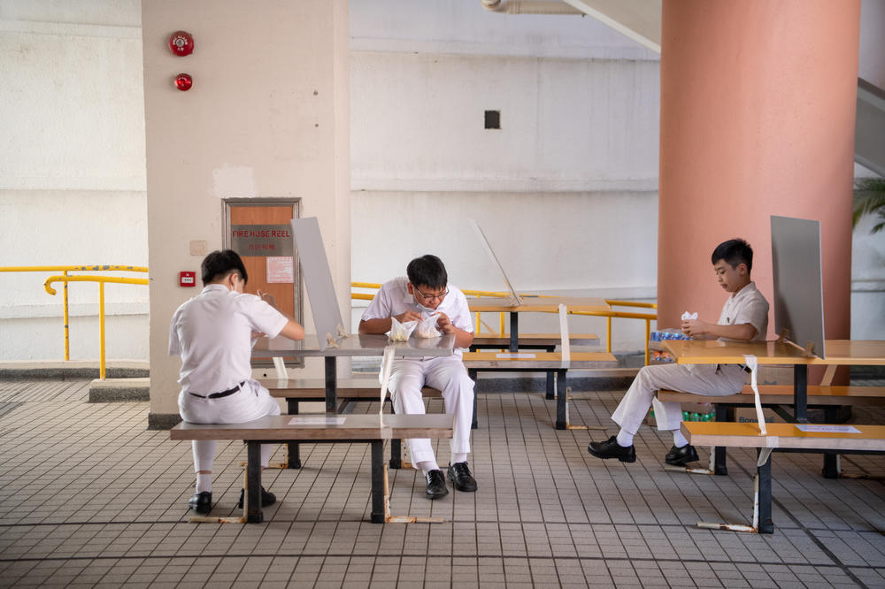 For snack time, tables are socially distanced — and some have dividers.