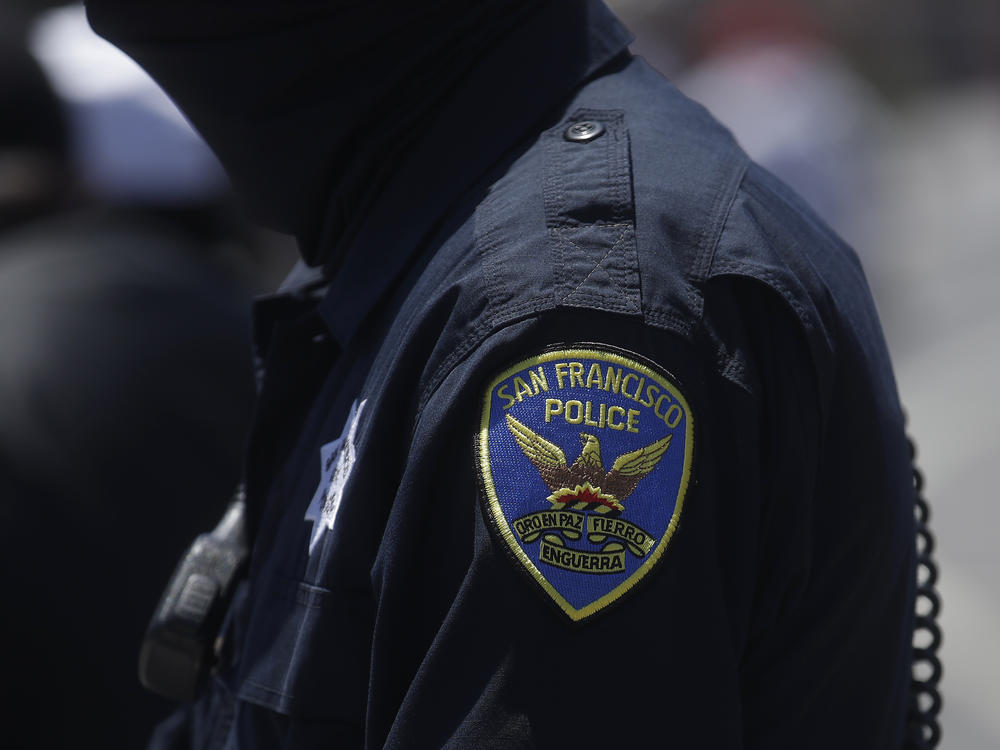 A San Francisco Police Department patch is shown on an officer's uniform. A new Pew Research Center survey shows changing opinions about law enforcement.