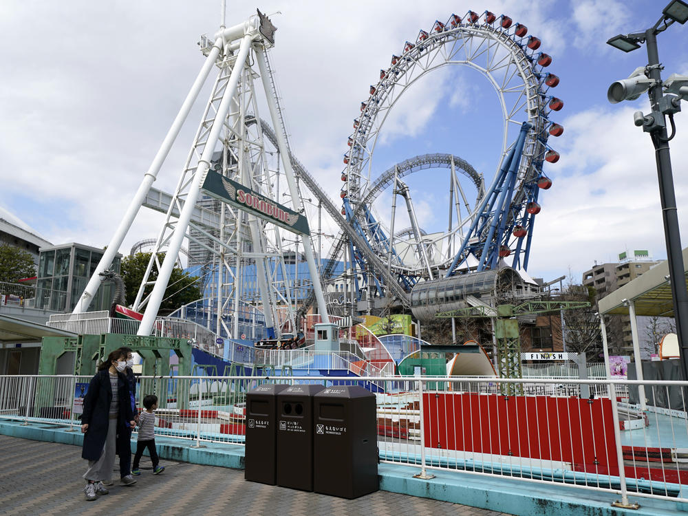 Japan's Tokyo Dome is shown before amusement rides began to reopen in the country. Japanese amusement park operators have asked people on rides at some parks not to scream.