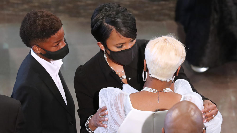 Bottoms consoles Tomika Miller, the wife of Rayshard Brooks, at the conclusion of his June 23 funeral at Ebenezer Baptist Church in Atlanta. Brooks, 27, died June 12 after an officer shot him in a Wendy's parking lot.