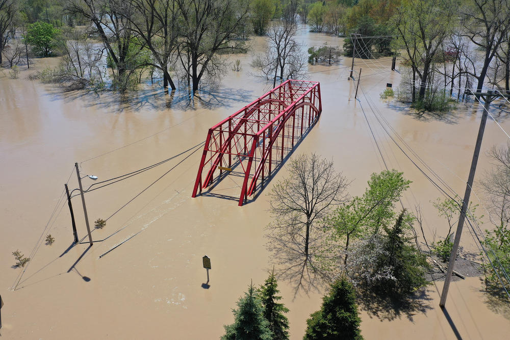 An aerial view of floodwaters flowing from the Tittabawassee River into the lower part of downtown Midland, Mich., on May 20. Thousands of residents were ordered to evacuate after two dams collapsed, causing flooding.