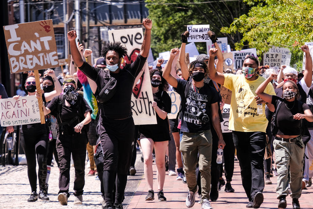 A crowd of peaceful protesters march through downtown Richmond, from Brown's Island to the 17th Street Market in Shockoe Bottom, June 7.