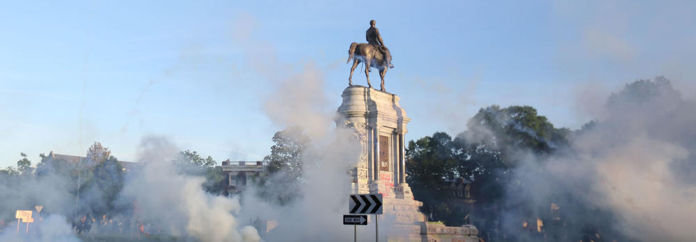 Tear gas clouds the air around the Monument Avenue statue of Confederate Gen. Robert. E. Lee on June 1, when Richmond police scattered hundreds of peaceful protesters by releasing tear gas and shooting pepper spray about 30 minutes before the 8 p.m. curfew was to go into effect.