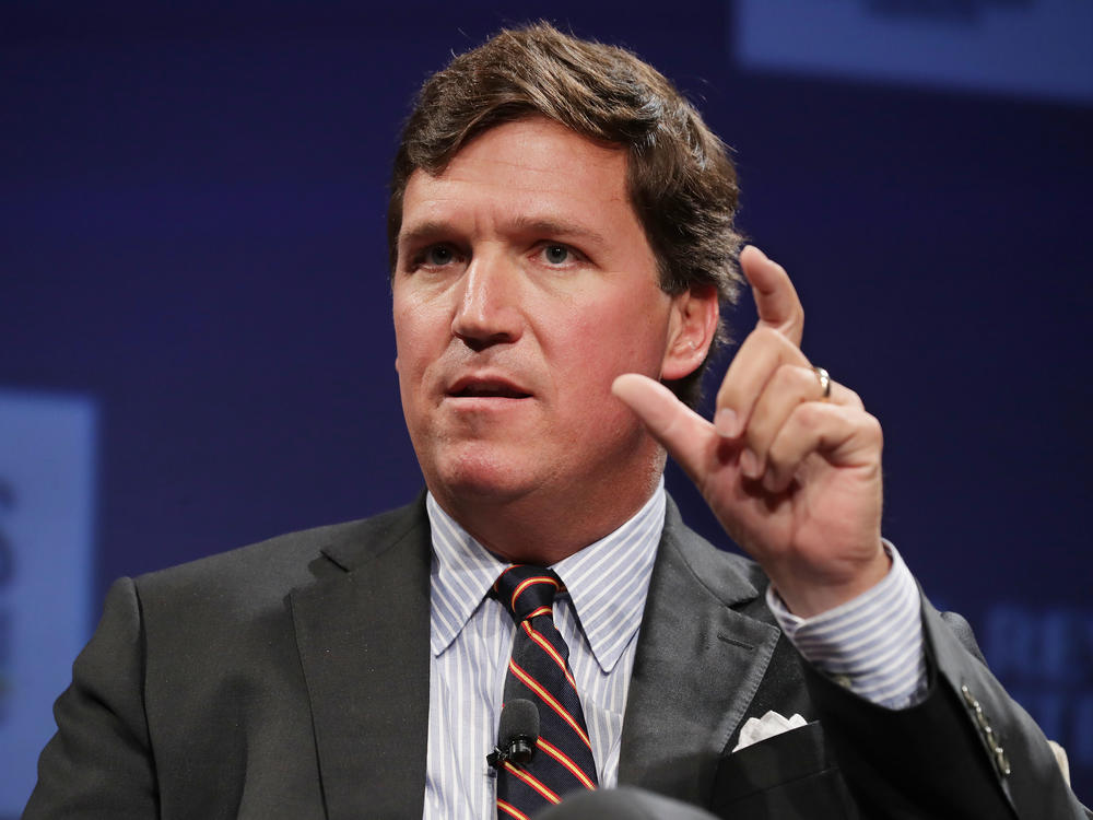 A top writer for Fox News' Tucker Carlson resigned after CNN revealed his racist and sexist posts, reviving criticism of Carlson's commentaries. Carlson is set to address the controversy on Monday.