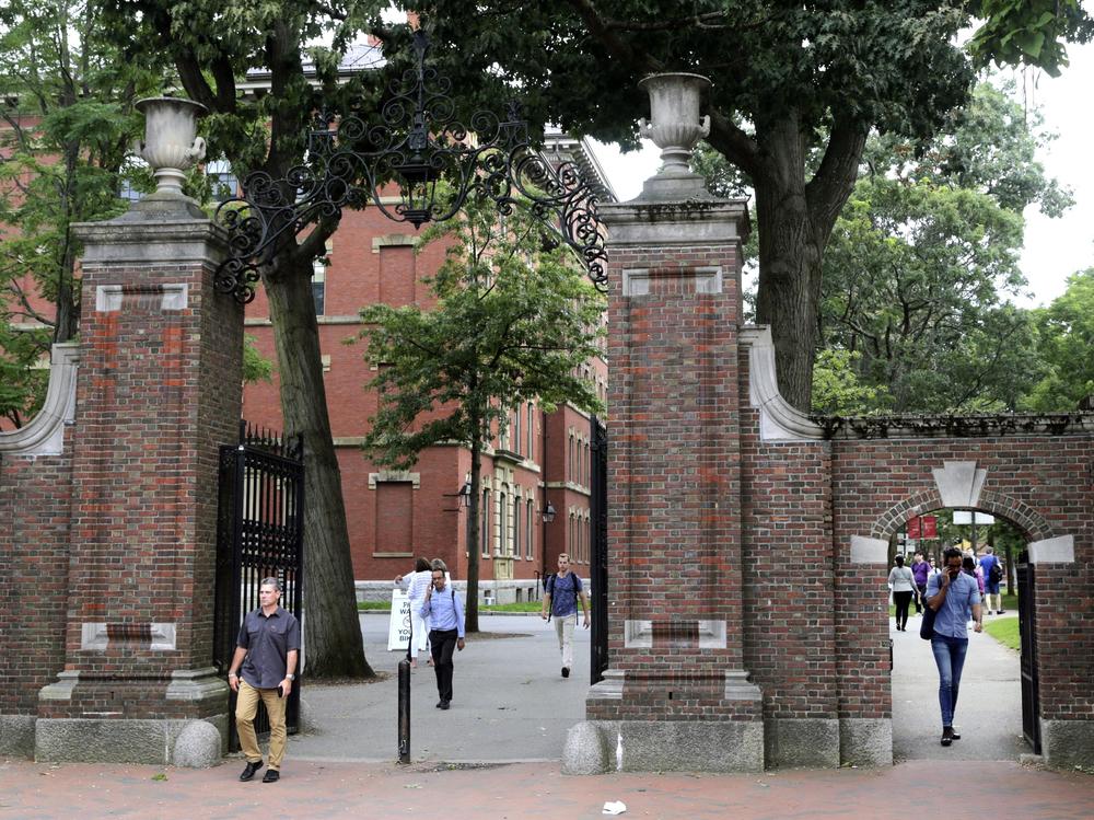 Pedestrians in Harvard Yard in 2019. Schools and businesses have gone to court to stop the Trump administration from barring online-only international students from entering or staying in the United States.