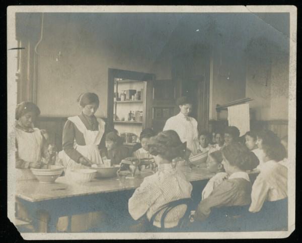 Reflecting the growth of black colleges in Atlanta, this is a class in cooking, ca. 1900, at Atlanta University. On exhibit in 