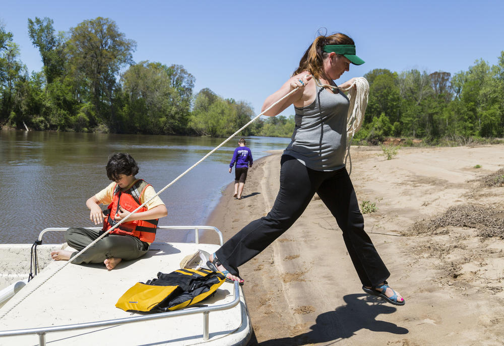Savannah Riverkeeper Tonya Bonitatibus with her sons on a favorite sand bar just upstream of Plant Vogtle. She worries that environmental safeguards might be the first corners cut if money for the Plant Vogtle construction project gets tight.
