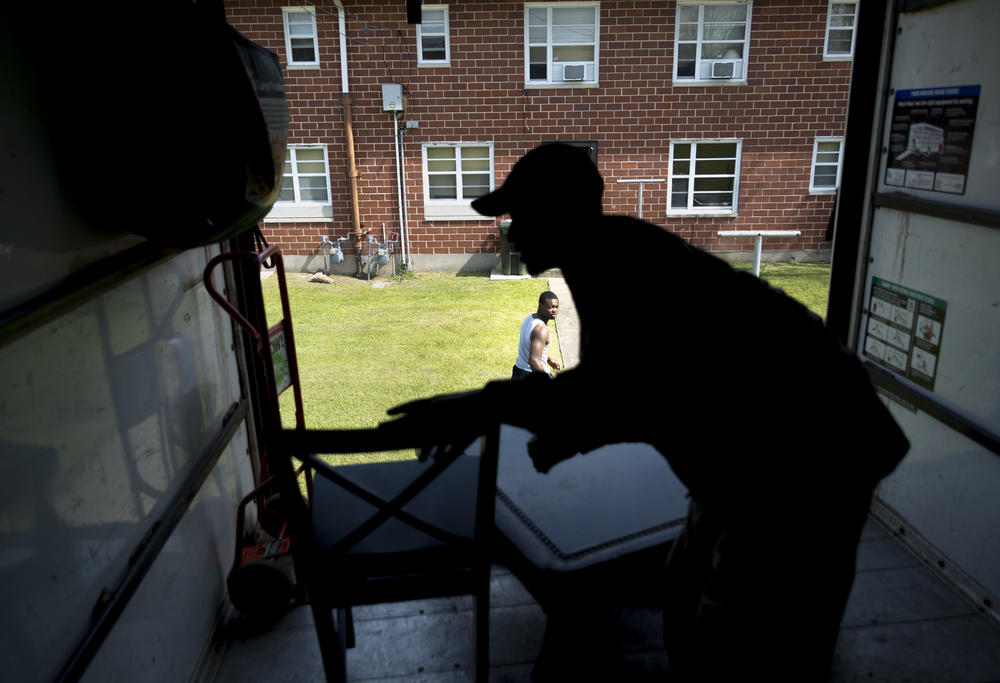 Kenny Howell Jr. looks back into the back of the moving truck.