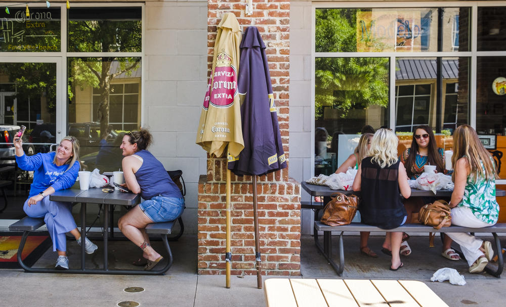 Diners outside a Mexican restaurant near Mercer University in Macon were separated by a brick pillar and a few feet Tuesday. 
