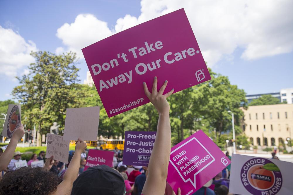 Anti-Abortion protestors rally outside of the Georgia State Capitol building following the signing of HB 481 in Atlanta, Tuesday, May 7, 2019. 