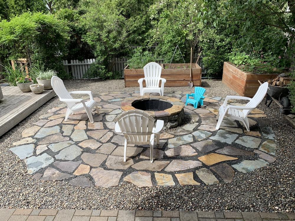Kevin Slover's new fire pit has become a popular gathering place where neighbors can sit together, six feet apart.