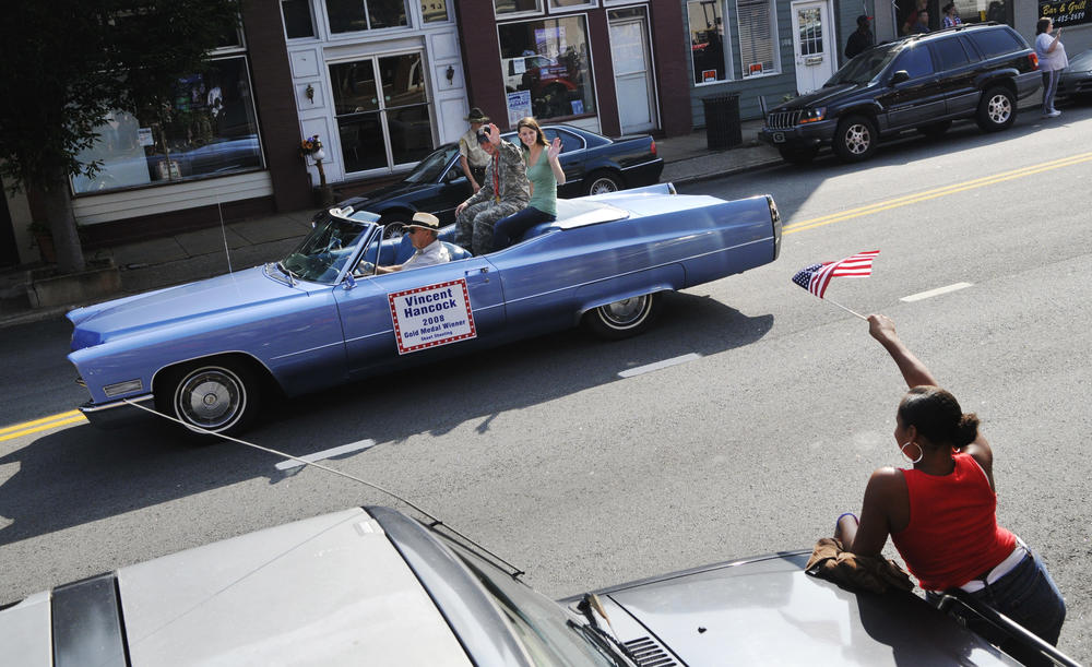 Vincent Hancock and his wife Rebekah in a parade in Eatonton, Ga. during a celebration of Hancock's 2008 gold medal in skeet shooting.
