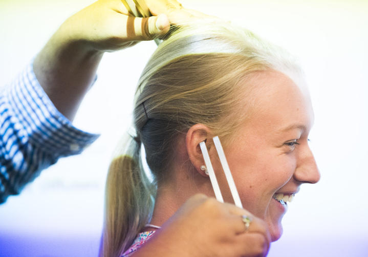 McKinley Cranford takes a basic hearing test with a tuning fork during the Mercer University Medical School tour.