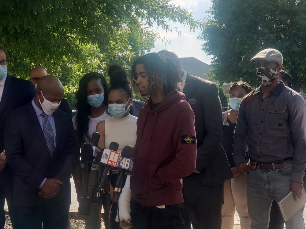 Messiah Young and Teniyah Pilgrim address the media Monday night alongside their families and their attorneys, Mawuli Davis and L. Chris Stewart.