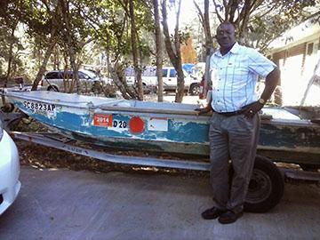 Savannah resident Ervin Simmons stands beside the boat he uses to visit Daufuskie Island, his childhood home.