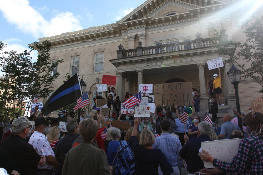 Protesters at Athens-Clarke County City Hall clash on June 16, 2020, in Athens, Georgia. A budget amendment proposing a reallocation of funds within the Athens-Clarke County Police Department brought hundreds of citizens out both in opposition and support of the proposal. 