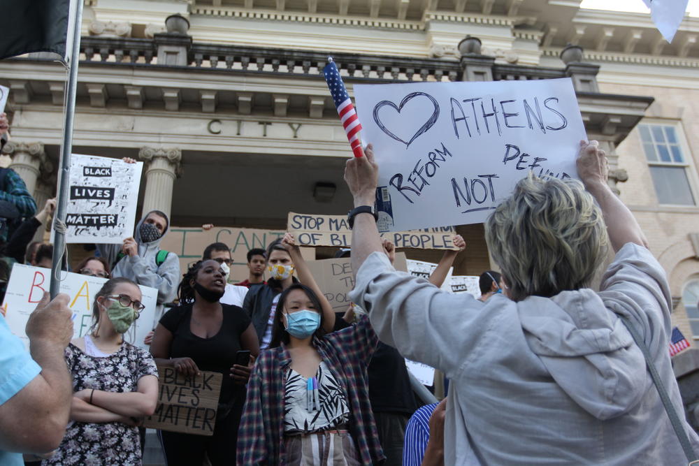 Protesters at Athens-Clarke County City Hall clash on June 16, 2020, in Athens, Georgia. A budget amendment proposing a reallocation of funds within the Athens-Clarke County Police Department brought hundreds of citizens out both in opposition and support