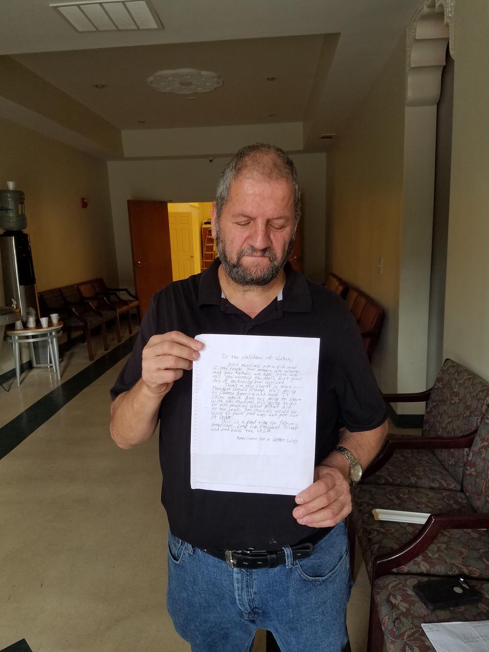 Arafet Afaneh, the facilities manager for the Islamic Center of Savannah, holds the anonymous letter the mosque received.