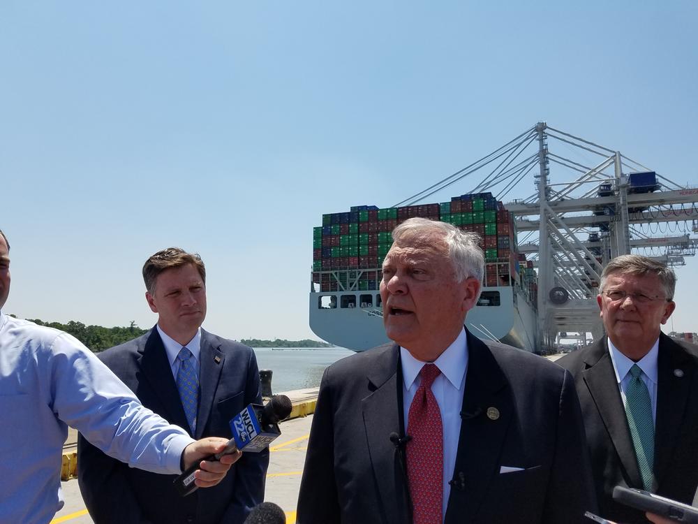 Gov. Nathan Deal speaks to reporters at the Port of Savannah, in front of the largest container ship ever to call on the East Coast.