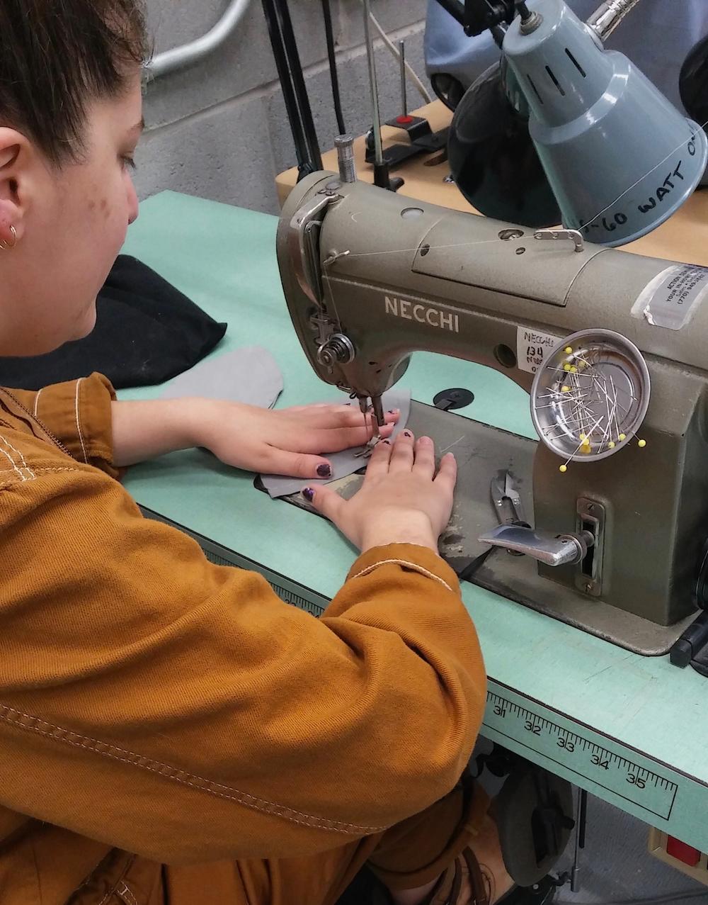 Atlanta Opera costume shop employees begin making masks for healthcare workers.