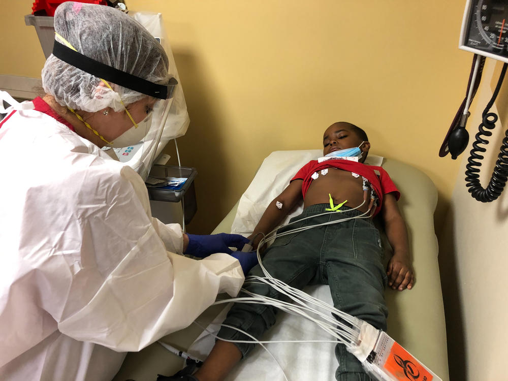 Marcelina Alvarez, a technician at Montefiore Medical Center in the Bronx, administers an EKG to Israel Shippy to check the functioning of his heart.