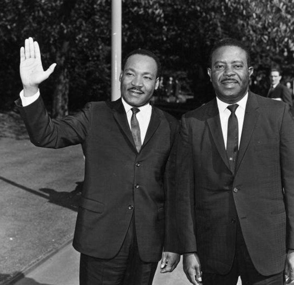 Ralph Abernathy (right) standing with Dr. Martin Luther King Jr.