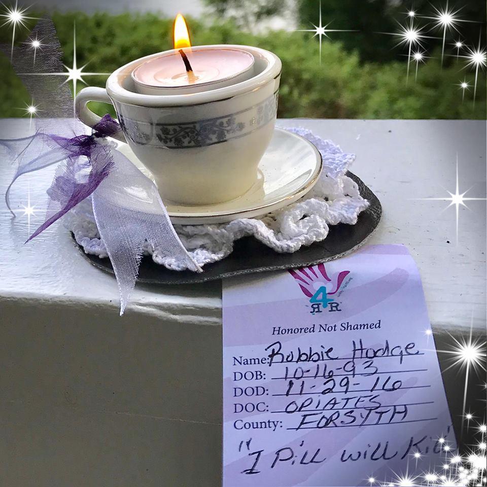 A teacup candle for Robbie Hodge, who died in 2016 at the age of 23. 