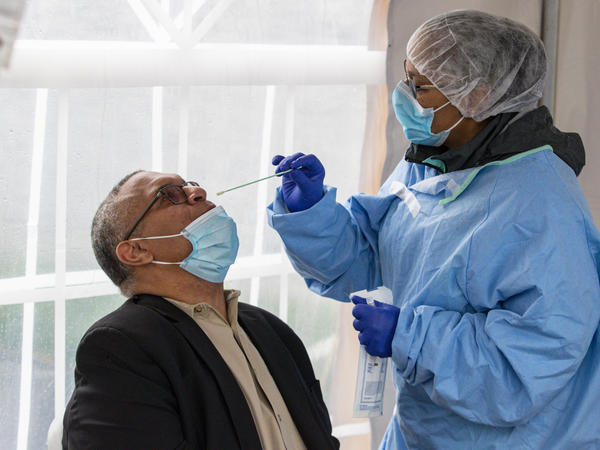 Indiana gubernatorial candidate Dr. Woody Myers takes a COVID-19 test at Aria Diagnostics in Indianapolis last week.