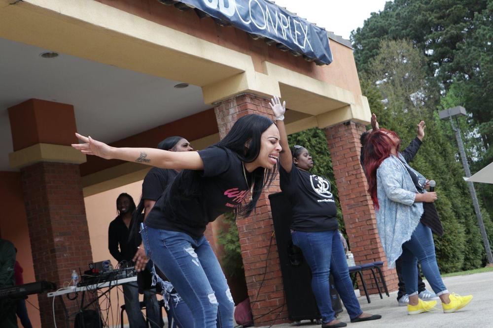 Worship leaders maintain at least six feet of distance between others during church services.