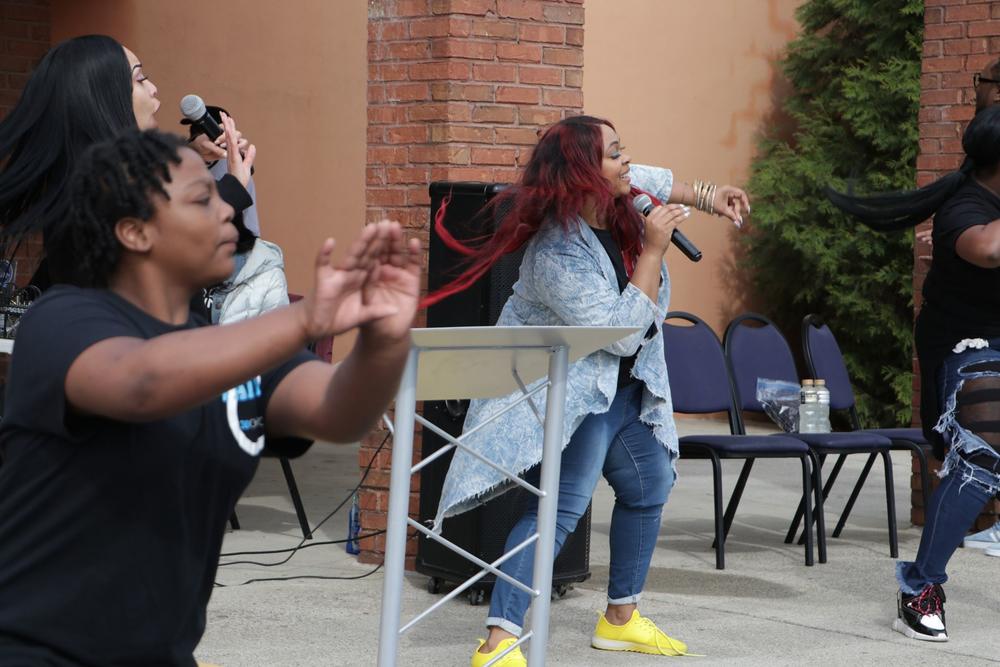 Co-pastor and First Lady Terrie Elmore leads the crowd during a song.