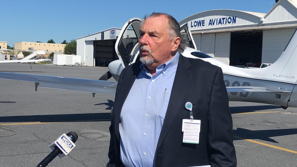 Navicent Vice President of Clinical Support Michael Hajworonsky stands in front of an Angel Flight Soars airplane. The charity's flight service has cut the hospital's coronavirus testing transport time in half.