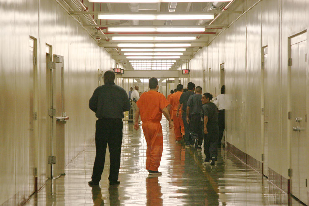 This April 13, 2009 photo shows a detainee at Immigration and Customs Enforcement's Stewart Detention Center in Lumpkin, Ga., leaving the cafeteria after lunch to go back to their living units. 